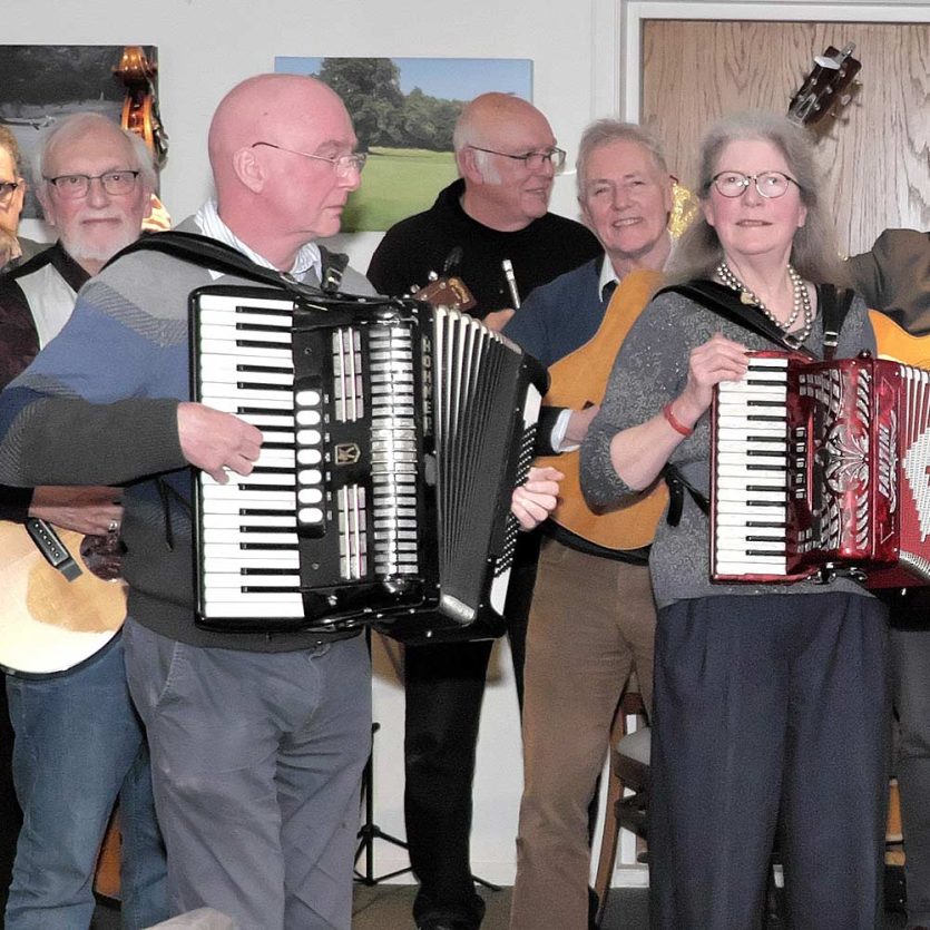 Member of Dorking Folk Club performing